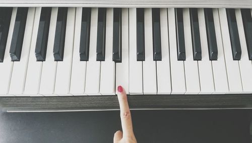 Low section of person on piano