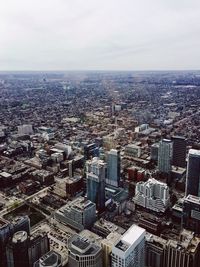 Aerial view of cityscape against sky