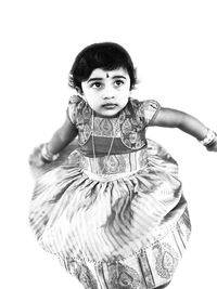 Portrait of a girl standing against white background