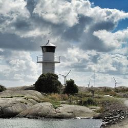 Lighthouse against cloudy sky