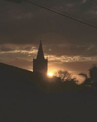 Low angle view of building against sky during sunset