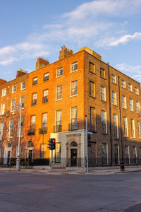 Building by street against sky