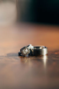 Close-up of wedding rings on table