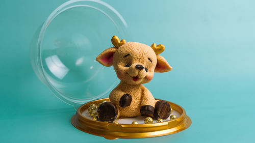 Close-up of stuffed toy against blue background