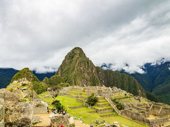 Scenic view of mountain against cloudy sky