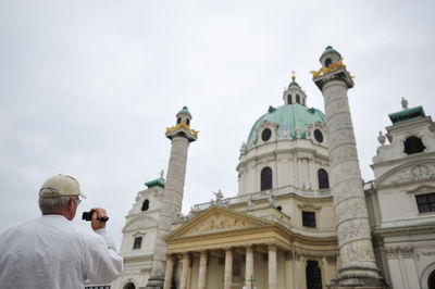 Low angle view of statue against building