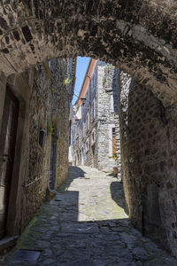 Narrow alley amidst old buildings