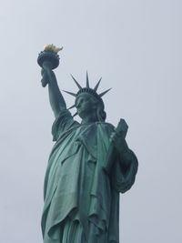 Low angle view of statue of liberty against clear sky