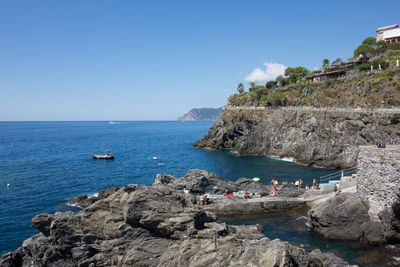 Scenic view of sea against clear blue sky
