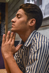 Portrait of young man looking away