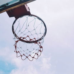 Low angle view of basketball hoop against sky