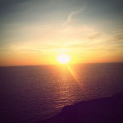 Scenic view of sunset over sea