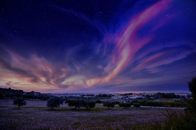 Scenic view of rainbow against sky at night