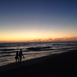 Scenic view of sea at sunset