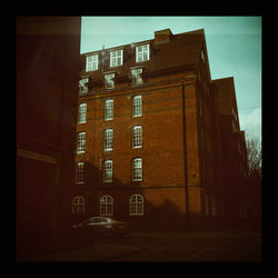 Low angle view of building against sky at dusk