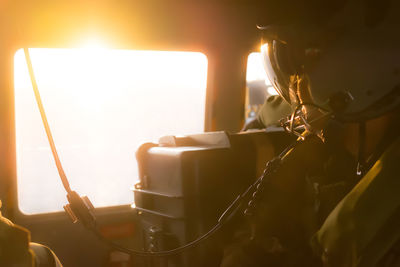 Midsection of soldier traveling in helicopter