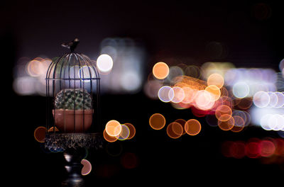Close-up of illuminated lantern against black background