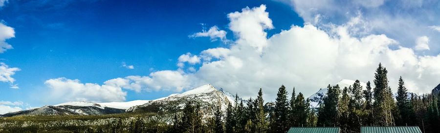 Scenic view of mountains against cloudy sky