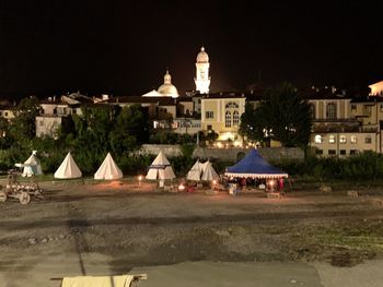 Buildings in city at night