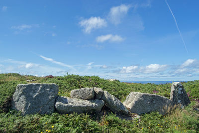 Rocks on land against sky