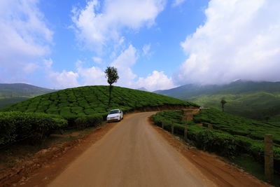 Empty road passing through mountains