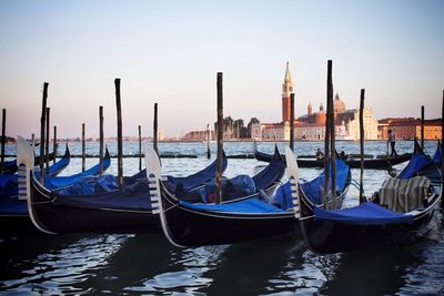 Boats moored in canal