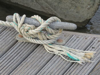 High angle view of rope tied on cleat