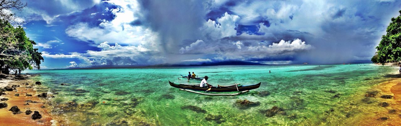 sky, water, sea, cloud - sky, tranquil scene, scenics, beauty in nature, tranquility, nature, beach, lifestyles, cloud, horizon over water, transportation, leisure activity, men, vacations, nautical vessel, cloudy