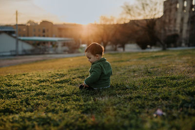 Boy looking away on field