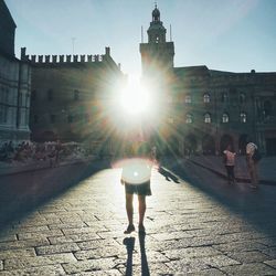 Rear view of man walking on street