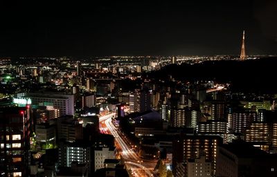 Aerial view of city lit up at night