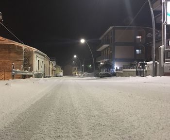 Snow covered city at night