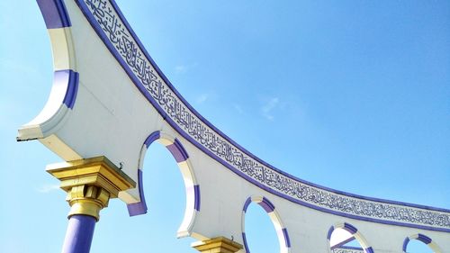 Low angle view of built structure against clear blue sky