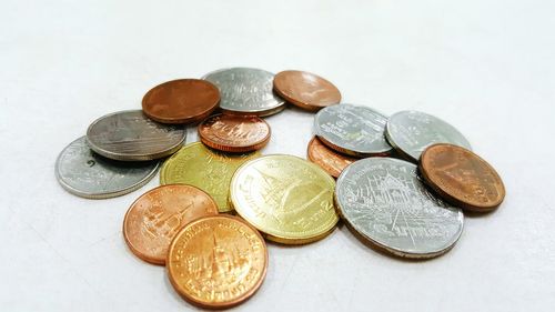 High angle view of coins on table