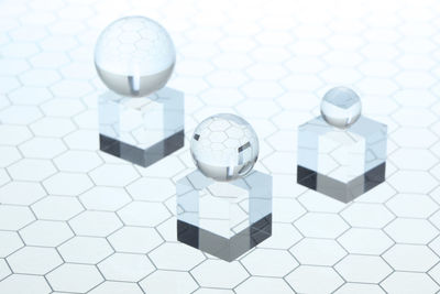 High angle view of glasses on tiled floor