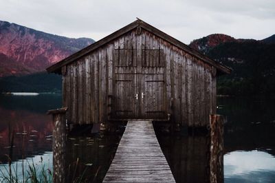 Pier over lake against sky