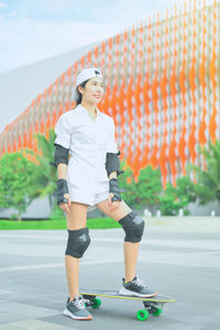 Woman skateboarding outdoors