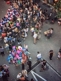 High angle view of people standing on street