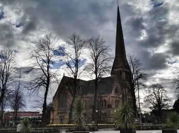 Low angle view of building against cloudy sky