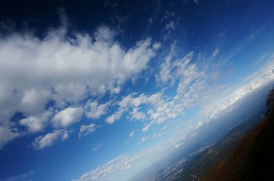 Scenic view of landscape against blue sky