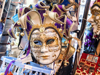 Close-up of venetian masks for sale in store