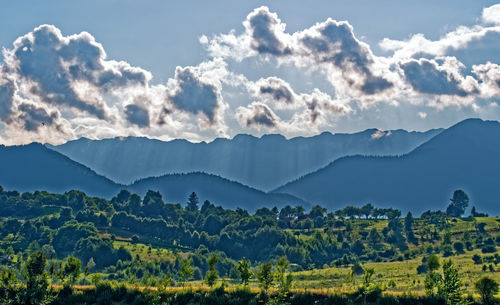 Scenic view of landscape and mountains against sky