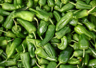 Full frame shot of green chili peppers for sale