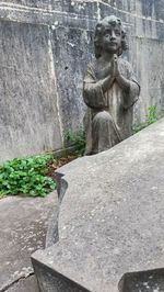 Statue against wall