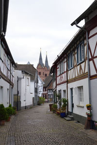 Street amidst buildings against sky