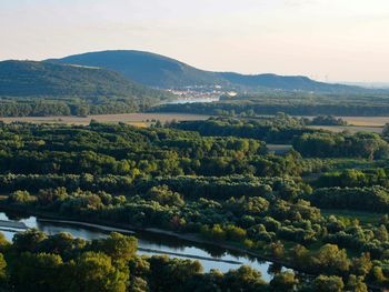 Scenic view of green landscape against sky