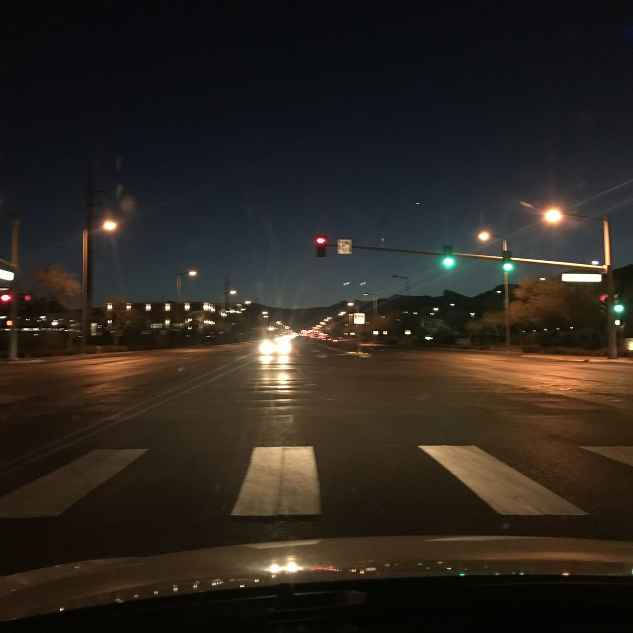 ILLUMINATED STREET LIGHTS AT NIGHT