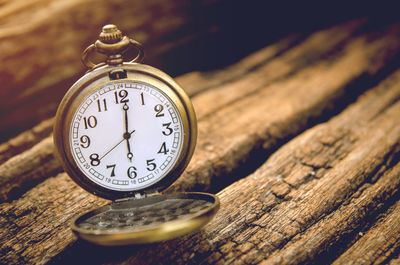 Close-up of vintage clock on table