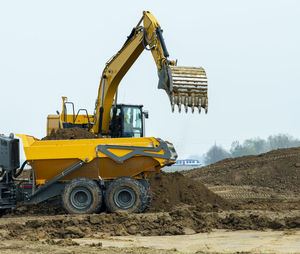 Construction site with digger and truck