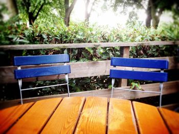 Empty wooden bench in park